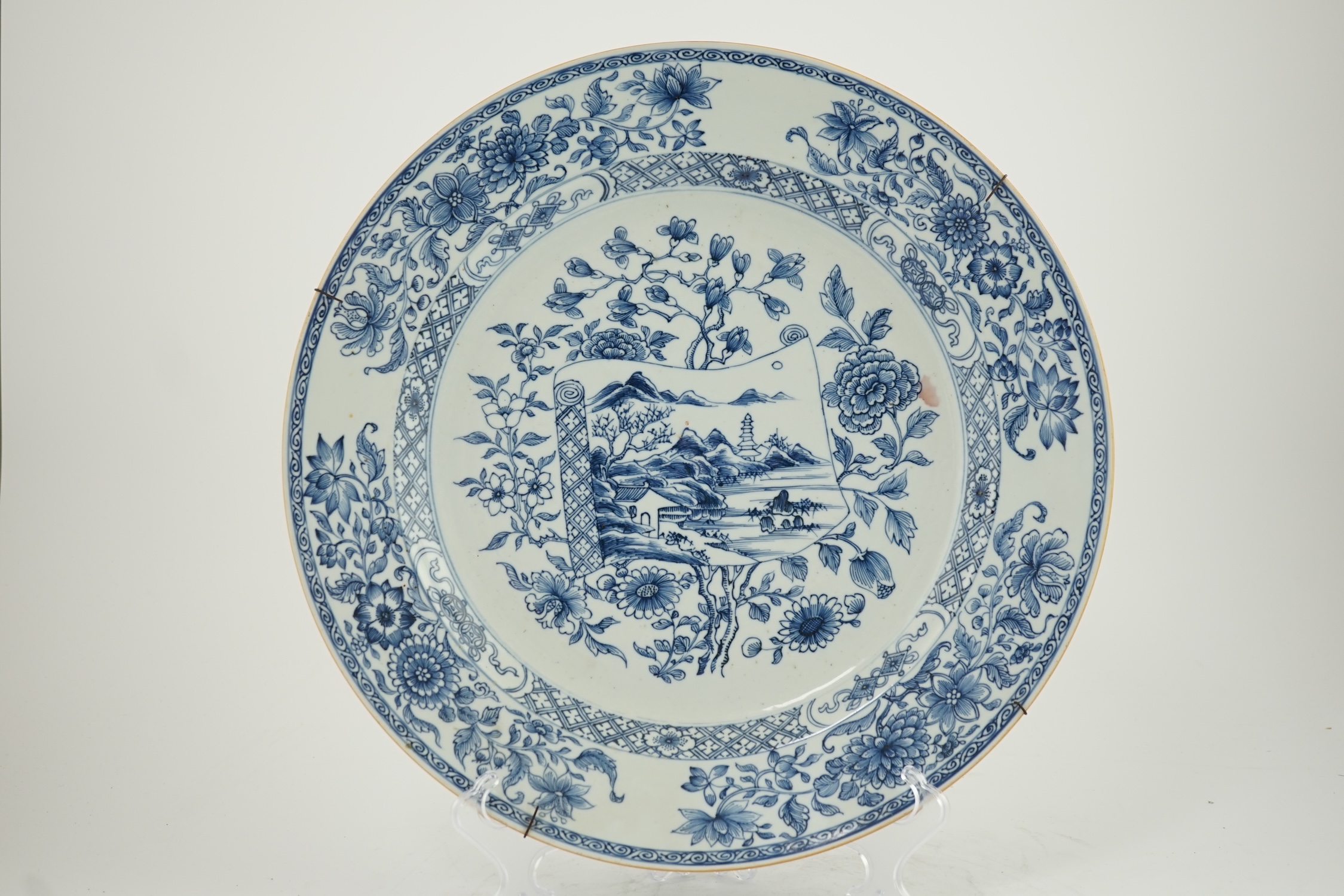 A Chinese blue and white 'scroll and blossom' charger, Qianlong period